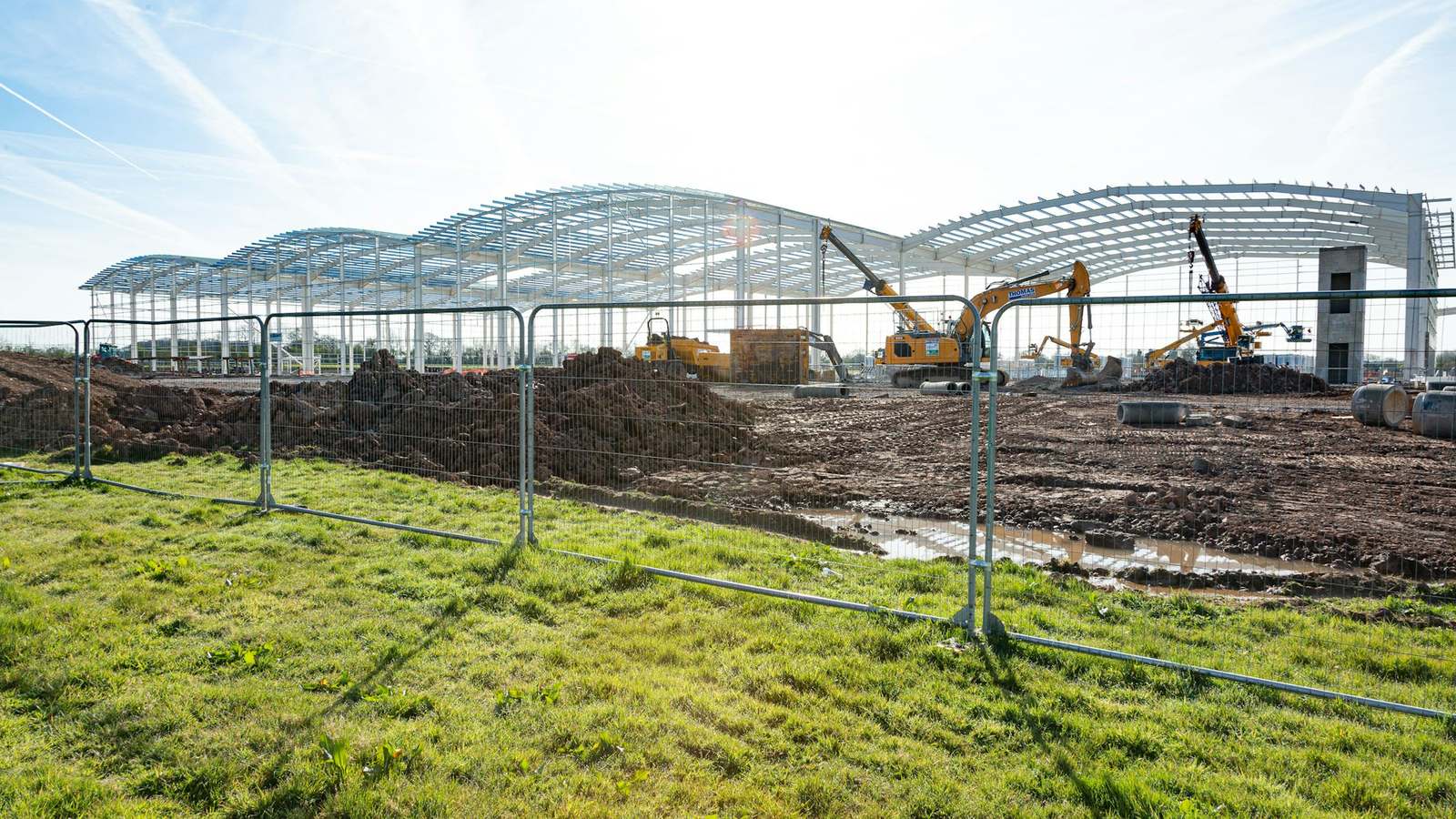 Steel portal frames going up on a commercial building site
