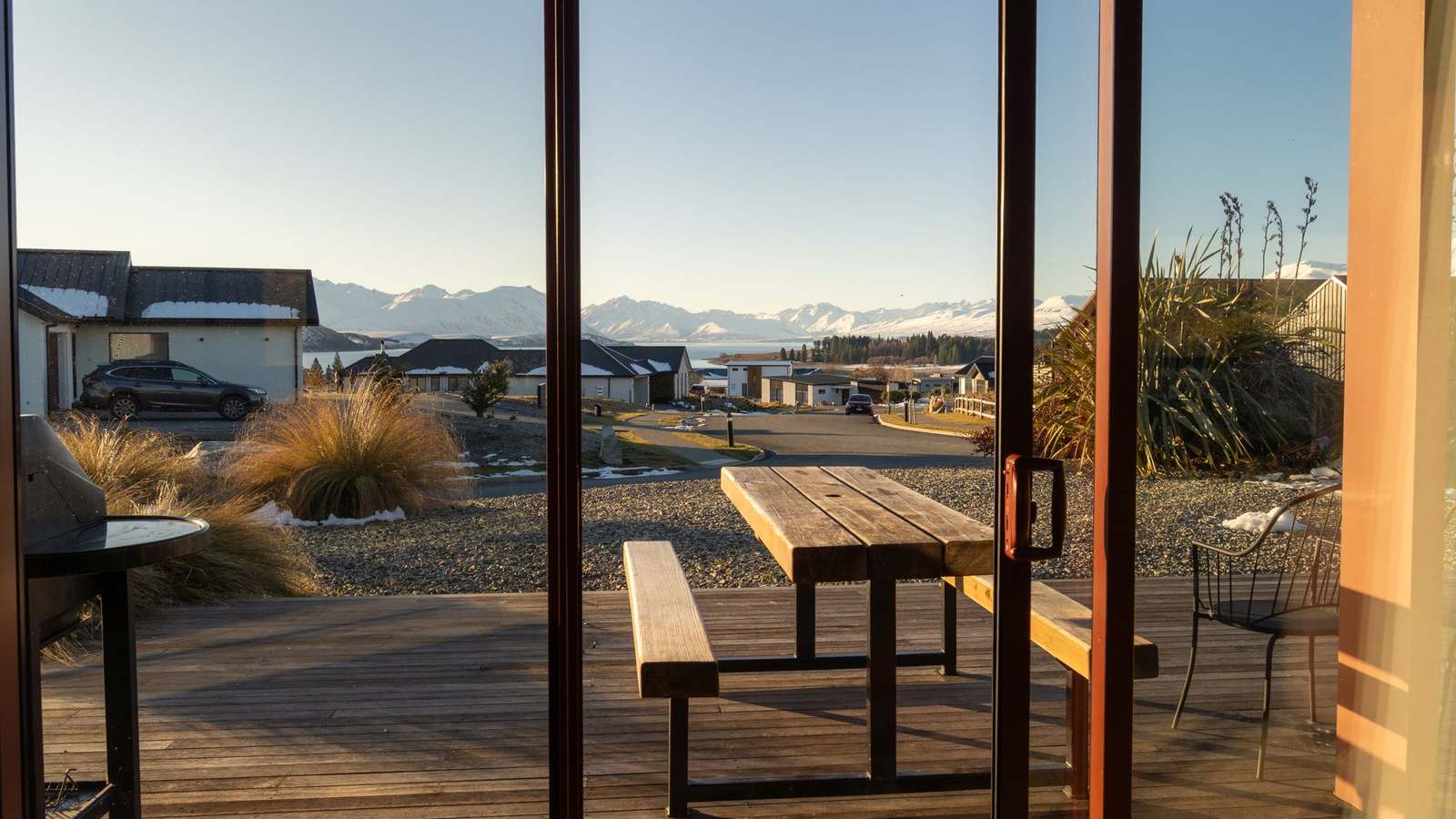 A timber deck looking out to the Southern Alps at Lake Tekapo