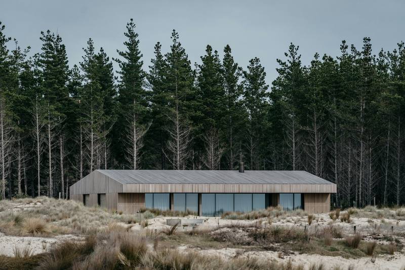 A new cedar-clad house in the dunes at Mangawhai, Northland