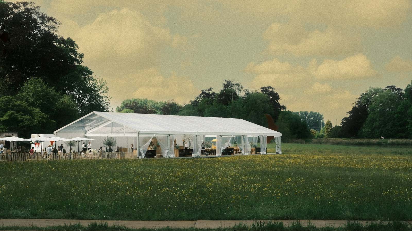 A white event marquee in a field