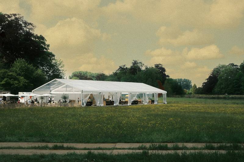 A white event marquee in a field