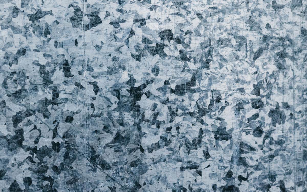 Close-up of hot-dip galvanised steel showing the crystal pattern of its zinc coating